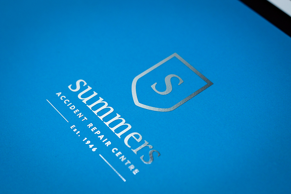 The New Summers Accident Repair Brand Identity That Was Made By Bison Printed On Cardboard