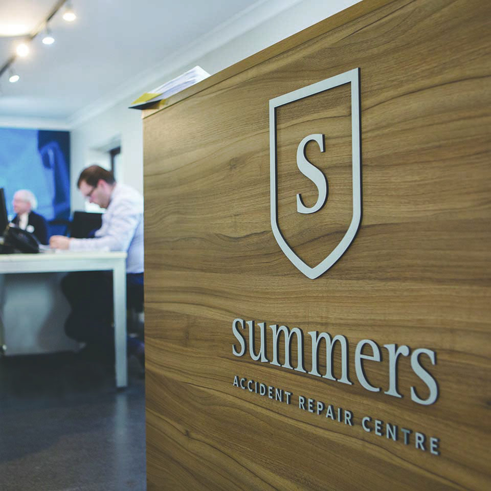 Door branded signage created for summers accident repair centre by Made by Bison